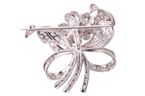 Lot 16 - A flower brooch set with diamonds, sculpted as...