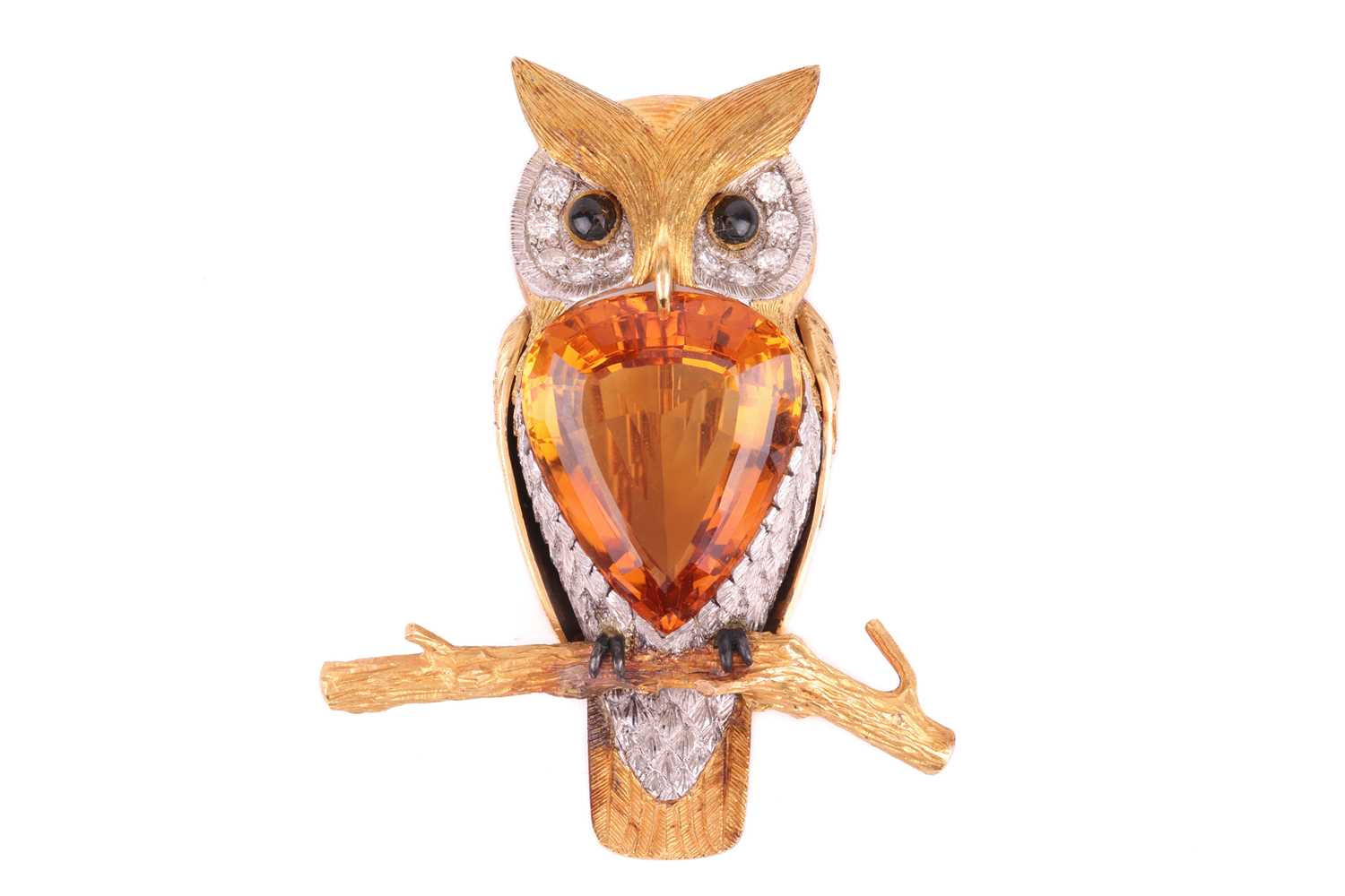 Lot 55 - A large gem-set owl brooch by E. Wolfe & Co.,...