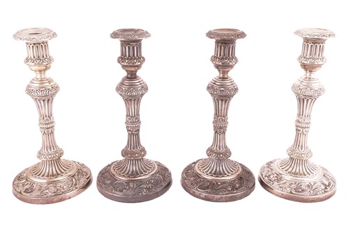 Lot 248 - A set of four silver George III candlesticks...