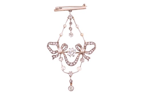 Lot 82 - An Edwardian diamond and pearl garland pendant...