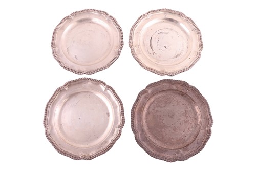 Lot 263 - A set of four George III silver dinner plates,...