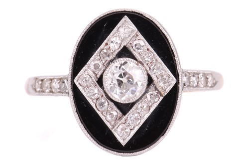 Lot 114 - An Art Deco onyx and diamond panel ring, the...