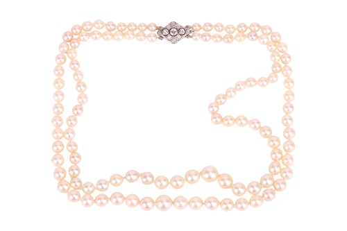 Lot 121 - A double-row cultured pearl necklace with a...