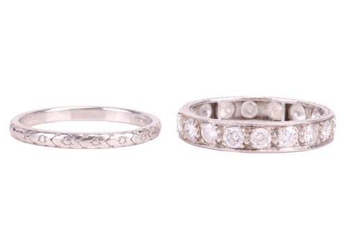 Lot 125 - A diamond eternity ring and a wedding band;...