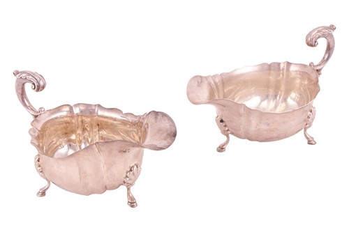 Lot 245 - A pair of early 20th century silver sauceboats...