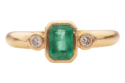 Lot 69 - An emerald and diamond three-stone ring in...