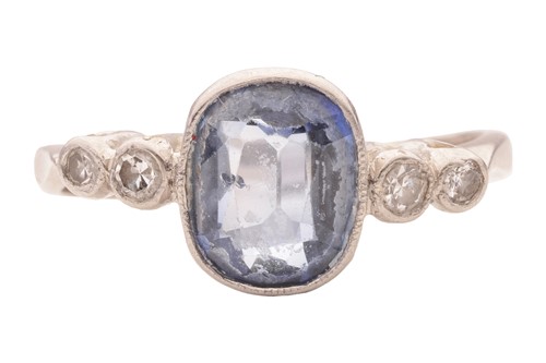 Lot 59 - A sapphire and diamond dress ring, centred...