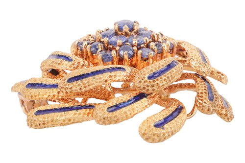 Lot 14 - An enamelled swirl brooch set with sapphires,...