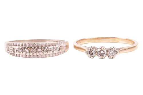 Lot 7 - A three-stone diamond ring, claw-set with...