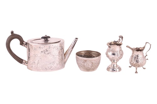 Lot 275 - A George III silver teapot with later chased...