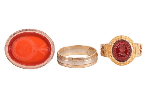 Lot 28 - Three rings comprising a carnelian seal ring,...