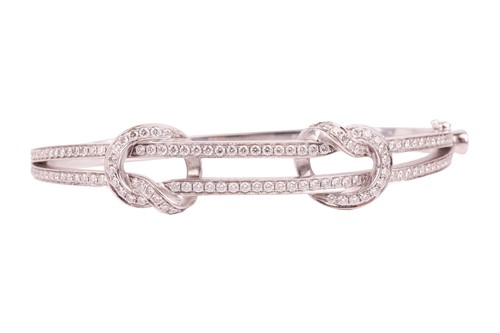 Lot 78 - Boodles - a 'Knot' diamond-set hinged bangle,...