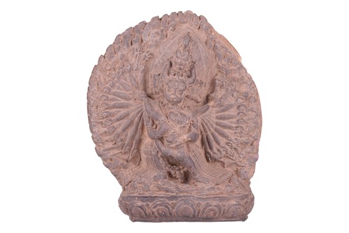 Lot 180 - A Tibetan terracotta votive figural plaque of...