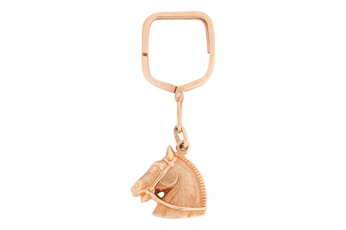 Lot 193 - A 1960s horse keyring, the horse head leading...