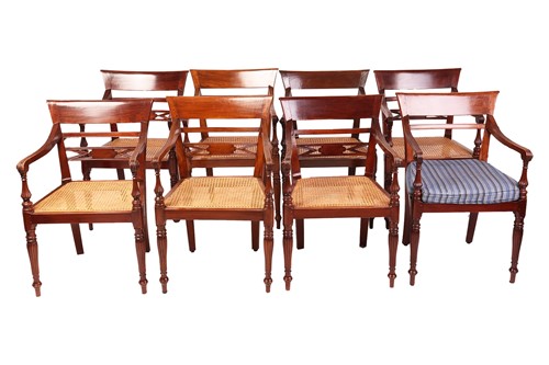 Lot 92 - A set of Anglo-Indian teakwood open-arm chairs,...