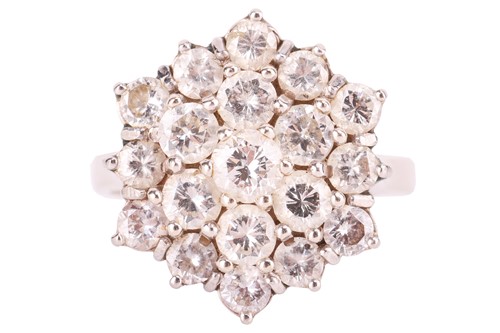 Lot A diamond cluster ring; composed of a central...