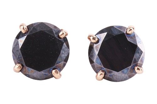 Lot 37 - A pair of black diamond stud earrings, each...