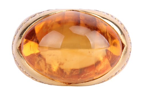 Lot 216 - A citrine and diamond cocktail ring, featuring...