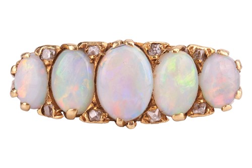 Lot 122 - An opal half hoop ring in 18ct gold, set with...