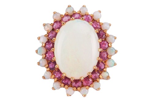 Lot 155 - An opal and ruby cluster ring, centred with a...