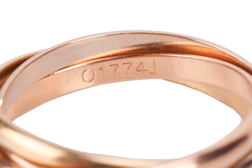 Lot 59 - Cartier- a trinity ring designed as a trio of...