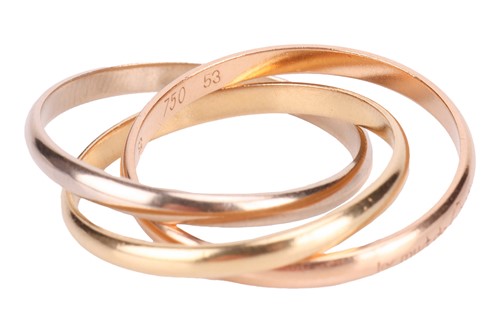 Lot 59 - Cartier- a trinity ring designed as a trio of...