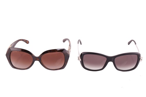 Lot 96 - A pair of black Cartier sunglasses, the arms...