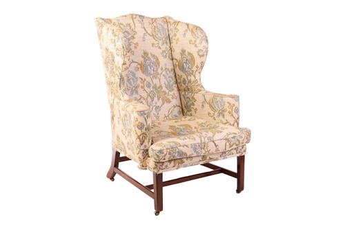 Lot 70 - A George III scroll arm wingback fireside...