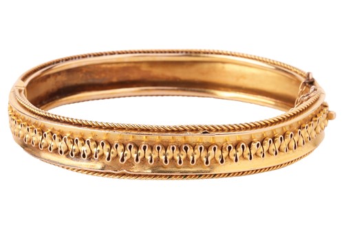 Lot 73 - A Victorian Etruscan revival bangle, with...