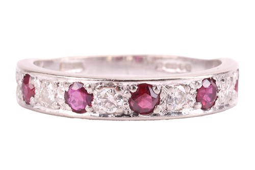 Lot 183 - A ruby and diamond half-eternity ring in 18ct...