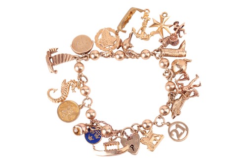 Lot 182 - A 9ct gold charm bracelet, the ball link...