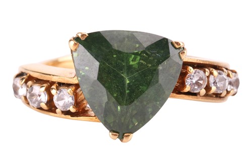 Lot 96 - A green metamict zircon dress ring, centred...