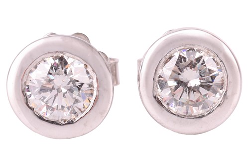 Lot 4 - A pair of diamond stud earrings in 18ct white...