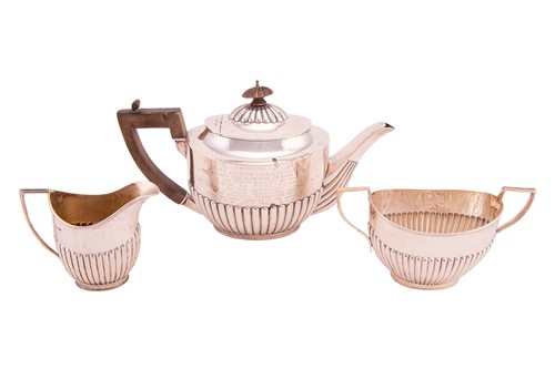 Lot 302 - A harlequin silver three-piece tea set, of...