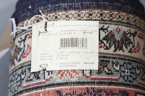 Lot 296 - A large Turkish woollen "Ladik" carpet with...