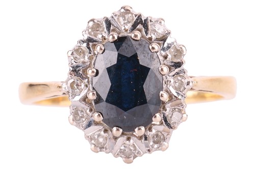 Lot A sapphire and diamond cluster ring in 18ct...