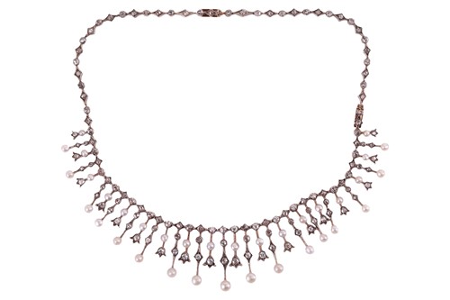 Lot 238 - An Edwardian diamond and pearl fringe necklace,...