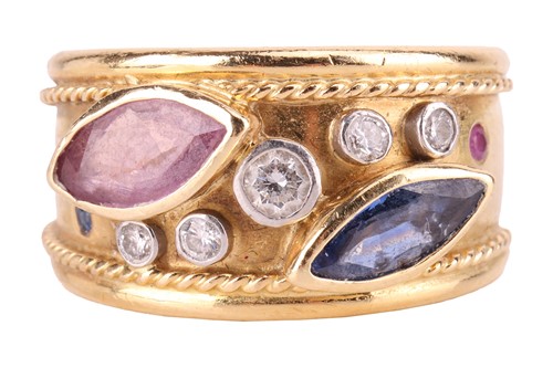 Lot 128 - A gem-set dress ring in Etruscan design, set...