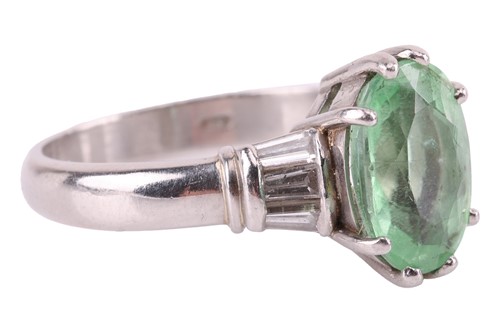 Lot 37 - A tourmaline and diamond dress ring, centred...