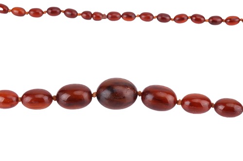 Lot 10 - Two beaded necklaces; to include a...