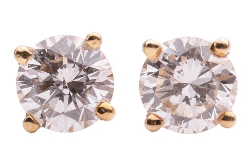 Lot 124 - A pair of diamond stud earrings in 18ct yellow...