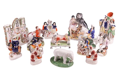 Lot A large collection of Staffordshire figures,...