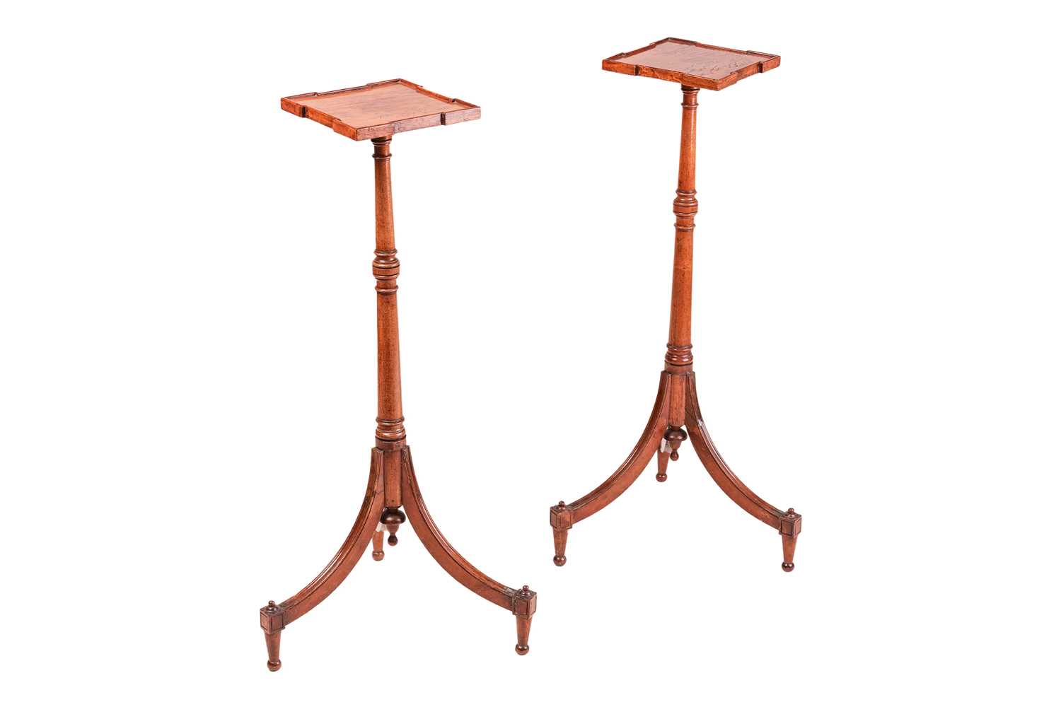 Lot 257 - A pair of George III figured mahogany tripod...