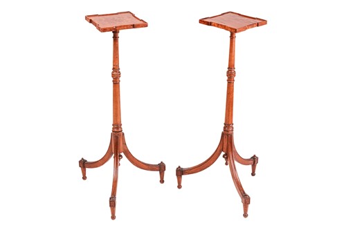 Lot 257 - A pair of George III figured mahogany tripod...