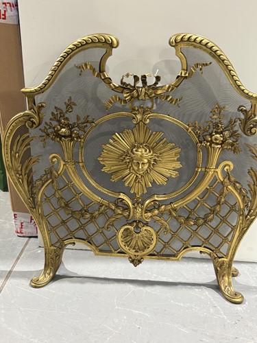 Lot 190 - A Louis V style gilt metal fire screen, with...