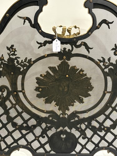 Lot 190 - A Louis V style gilt metal fire screen, with...