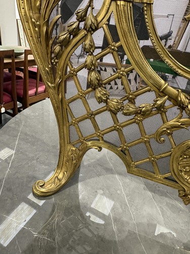 Lot 190 - A Louis V style gilt metal fire screen, with...