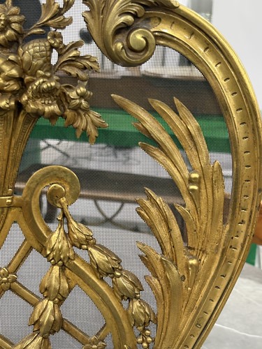 Lot 190 - A Louis V style gilt metal fire screen, with...