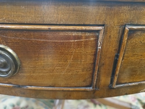 Lot 217 - A George III mahogany revolving circular drum...