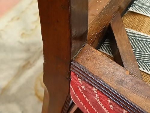 Lot 186 - A long set of fourteen Regency mahogany dining...